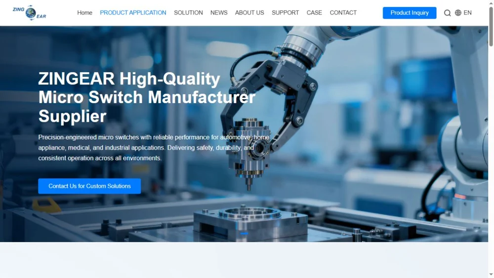ZINGEAR website banner showing a robotic arm above a precision manufacturing fixture.