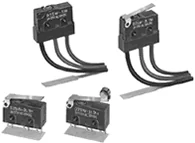 Four sealed micro switches with wire leads, plunger actuators and a lever actuator.